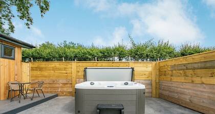 Luxurious lodge with vaulted ceilings and a welcoming feature fireplace.