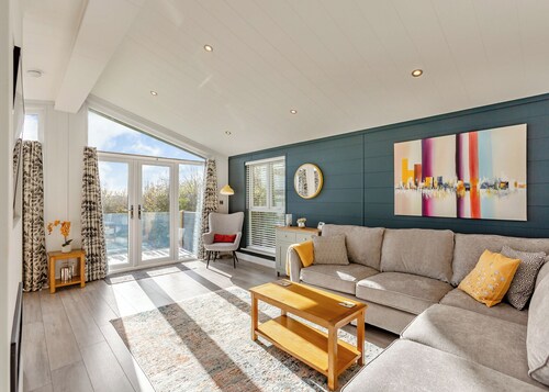 Luxurious lodge with vaulted ceilings and a welcoming feature fireplace.