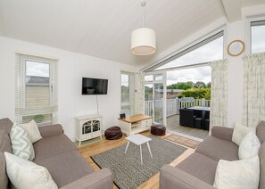 Living area - A cosy lodge with one master double and one twin. (Honiton)