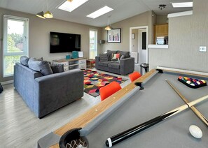 Living area - This deluxe two bedroom lodge even has its own games den. (Raywell, Beverley)