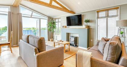 Luxurious lodge with vaulted ceilings and a welcoming feature fireplace.