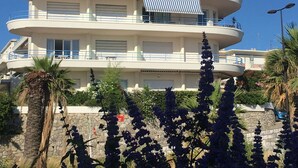 A multi-story building with balconies and a pool area. - Contemporary Apartment in Antibes with Terrace (Antibes)