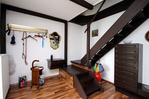 Cozy retreat with a bench, storage, and a wall-mounted coat rack.