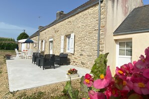 Enjoy a tranquil outdoor space with a patio area, perfect for relaxing with a view.