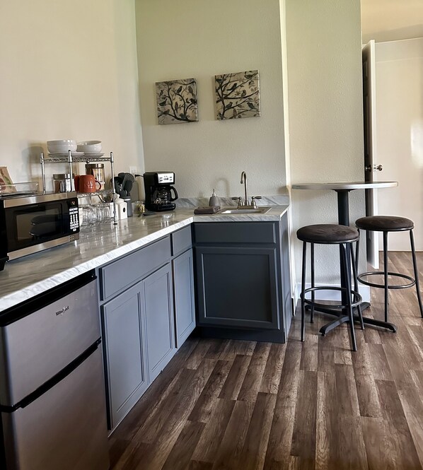 Fridge, microwave, stovetop, coffee/tea maker