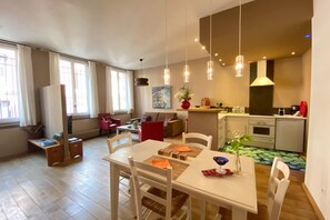 Cozy living space with a dining area, kitchenette, and comfortable seating.