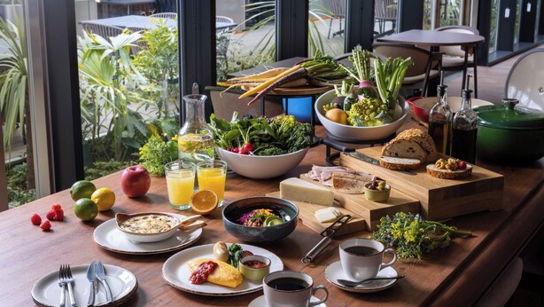 A breakfast table with various foods, drinks, and utensils. - HOTEL GROOVE SHINJUKU, A PARKROYAL Hotel (Tokyo)