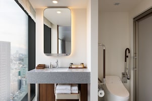 Premier Room, 2 Twin Beds, Roll-in Shower, Non Smoking | Bathroom | Hair dryer, slippers, bidet, towels