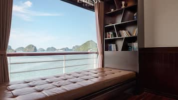 Enjoy a peaceful retreat with a serene view of the water and lush islands from the comfort of this cozy space.