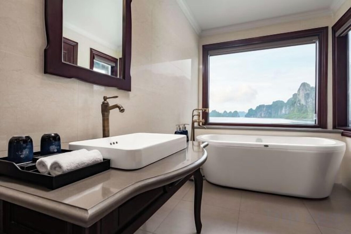 Separate tub and shower, hair dryer, bathrobes, slippers