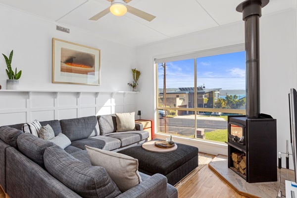 The living room looks inviting with its comfy couches, flat-screen TV, and Wi-Fi.