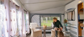 Chic caravan with awning on the Baltic Sea in Dierhagen