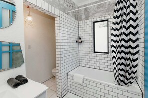 Bathtub, hair dryer, towels, soap