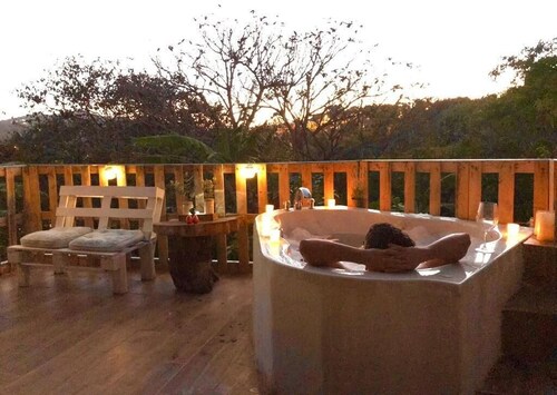 Cabin surrounded by nature at ground level with terrace