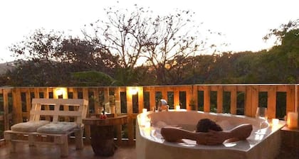 Cabin surrounded by nature at ground level with terrace