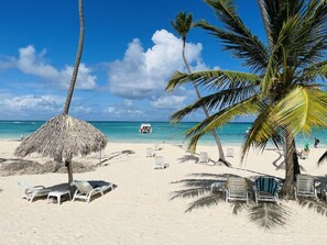 On the beach, sun loungers, beach towels