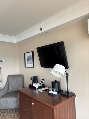 Standard Quadruple Room | Living area | Flat-screen TV