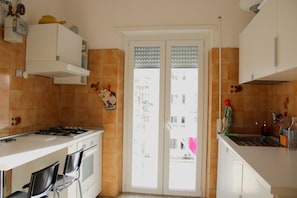 Full-sized fridge, oven, dishwasher, cookware/dishes/utensils