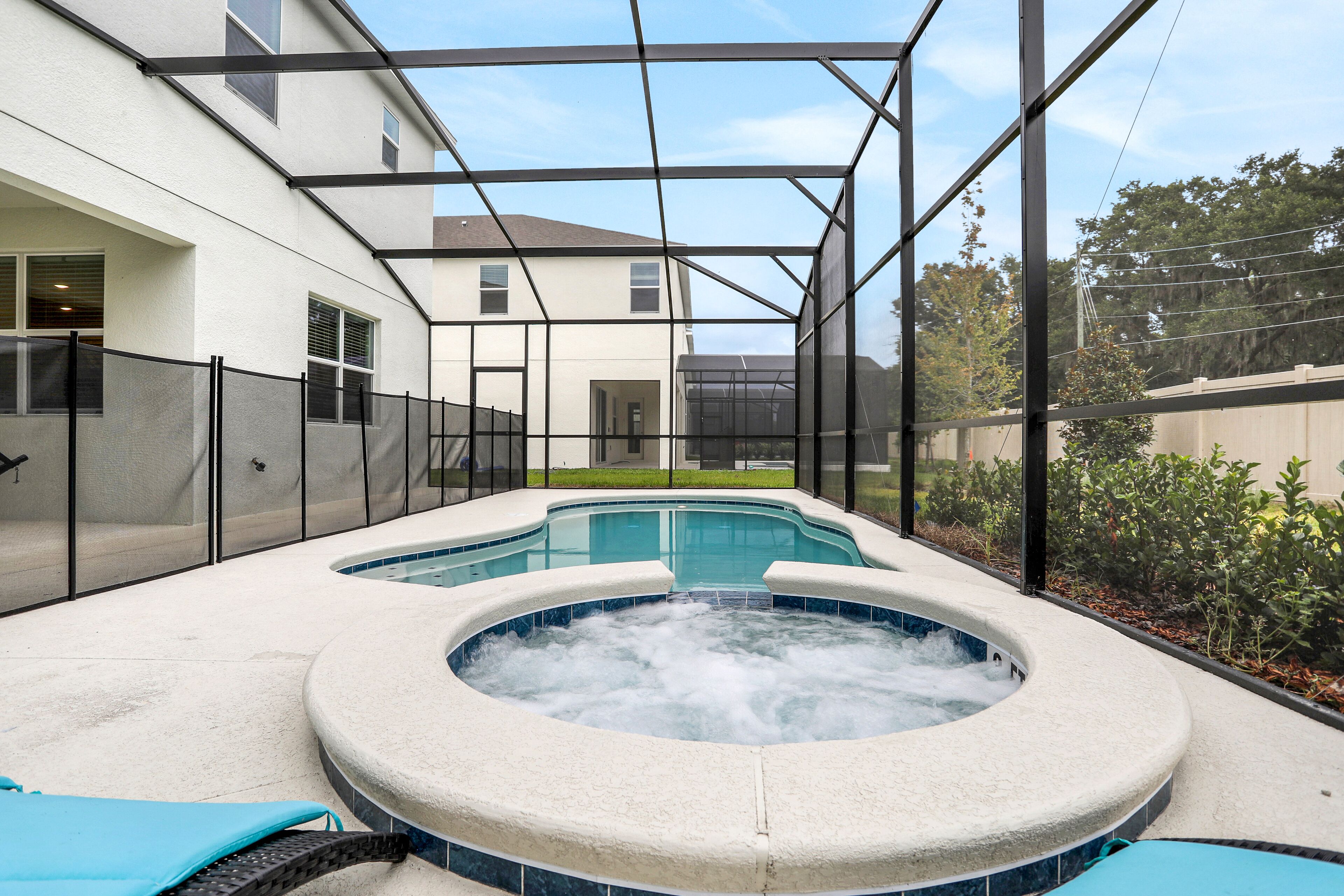 Dog-friendly home with a heated pool, pool spa, in-home theater, lanai, & patio