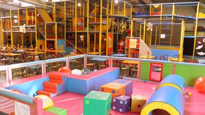 A children's play area with colorful play structures, tables, and chairs. - Villa with garden near beautiful golf course (Vasles)