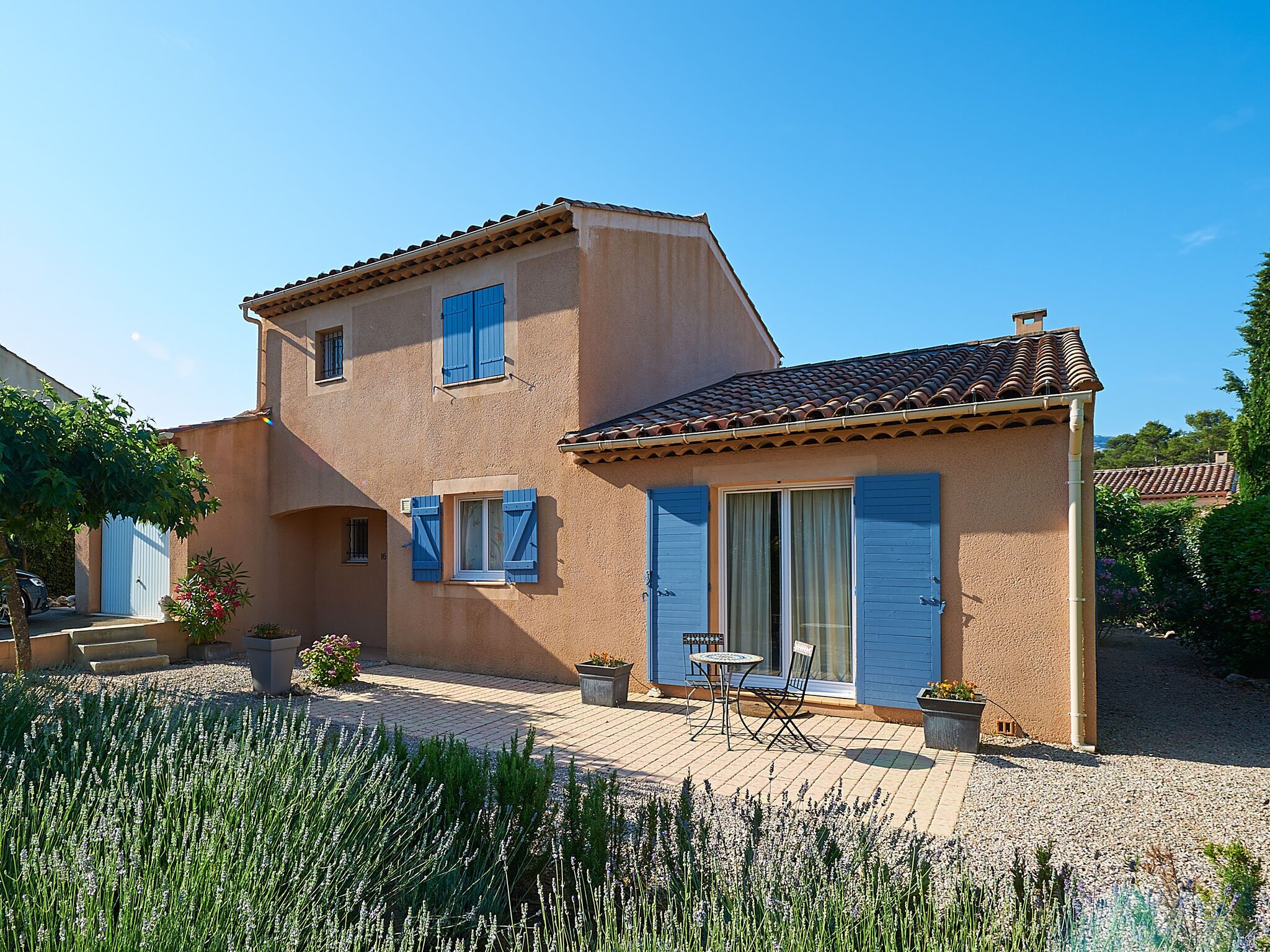 A two-story house with a patio area.