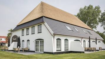 Experience the charm of Bravado's unique architecture, featuring a steeply pitched roof and symmetrical facade.