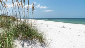 A beach with sand and tall grasses. - All open summer weeks just discounted up to 25%! Book now for lowest rates of th (Cape San Blas)