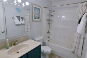 Combined shower/bathtub, hair dryer, towels, soap
