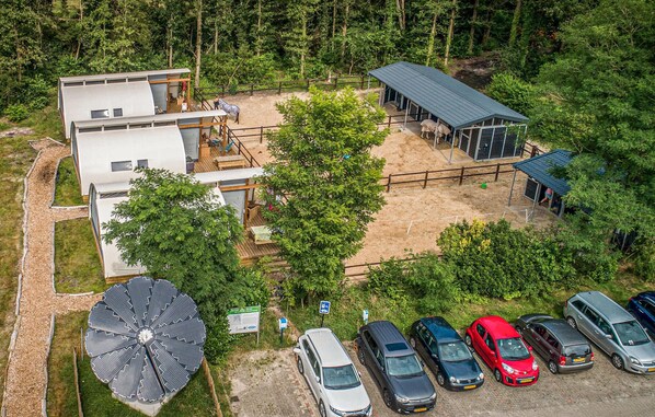 Residents enjoy a spacious outdoor area with a wooden deck and easy access to transportation.