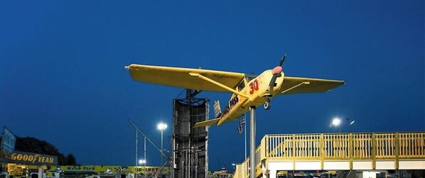 A yellow airplane with the number 30 on it, parked at an airport.
