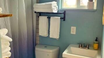 Hair dryer, towels, soap, shampoo