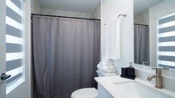 Hair dryer, towels, soap, shampoo