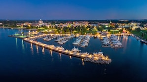 A marina with boats docked, a pier, and buildings in the background. - 🌆 539 Bay St Downtown Lakeview Condo | 402W  - Waterfront, Free Parking, Moments from festival grounds (Traverse City)