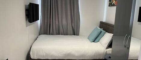 Apartamento, várias camas | 2 quartos, Wi-Fi de cortesia, roupa de cama