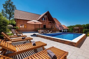 A heated pool, pool loungers