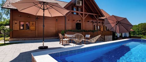 A heated pool, pool loungers