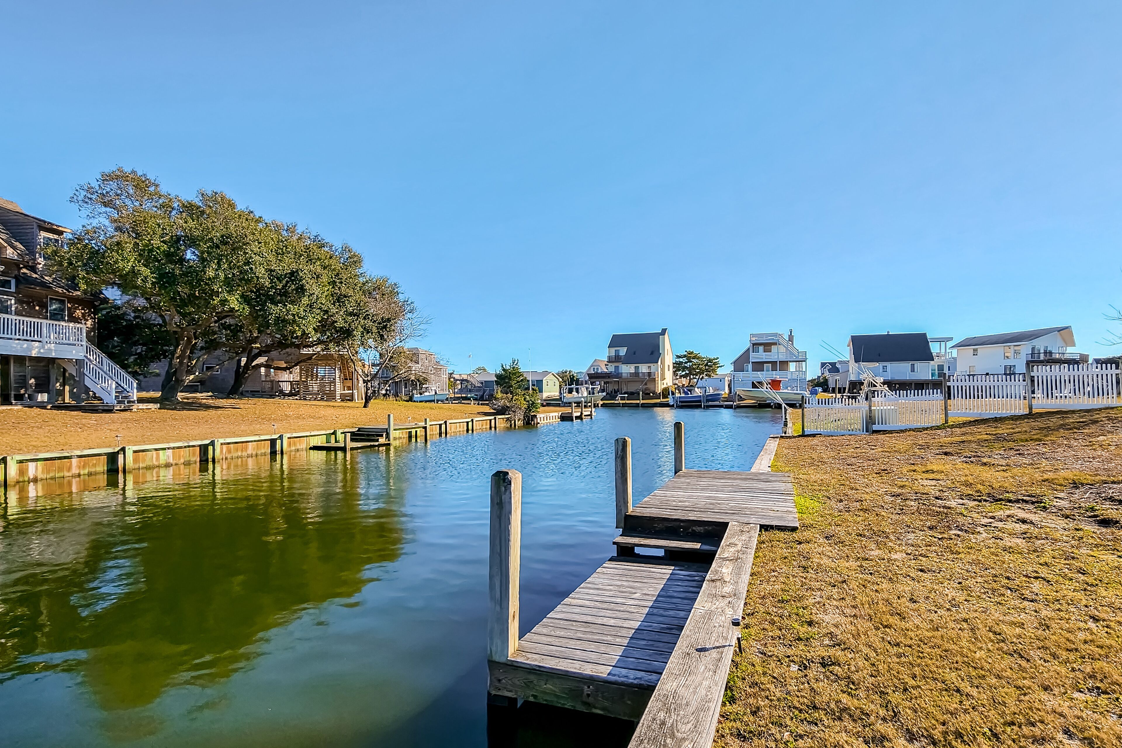 Canal-front home with front & rear decks, pool & private hot tub - dog-friendly