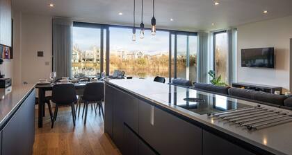 A contemporary glass fronted lake side home that sleeps 8 guests in 4 bedrooms