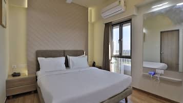 Premium bedding, down duvets, memory-foam beds, in-room safe