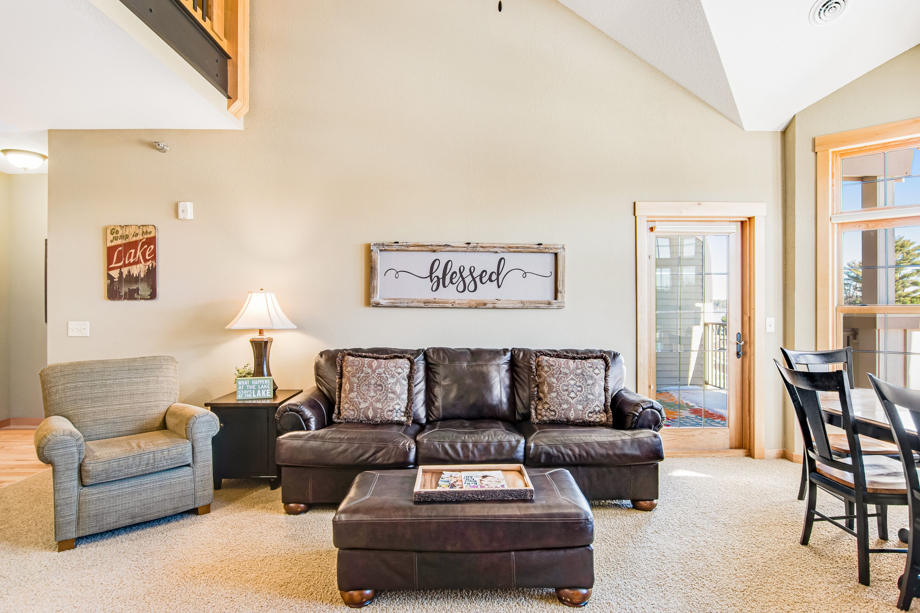 Lake-view condo with pool and hot tub access, jetted tub, firepit, and a balcony