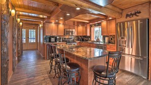 A spacious kitchen with a large island, stainless steel appliances, and wooden cabinetry. - Cascade Cabin w/ Mountain View & River Access (Cascade)