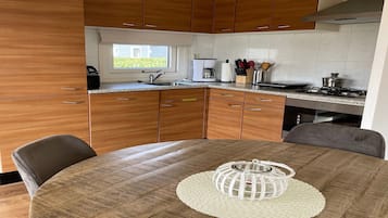 Fridge, stovetop, dishwasher, coffee/tea maker
