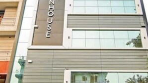 A multi-story building with a sign reading "TOWNHOUSE". - The Town House (New Delhi)