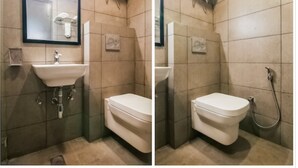 A bathroom with a sink, toilet, and shower. - The Town House (New Delhi)