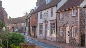 A traditional building with a sign for 'Badgers Tea House & Garden'.