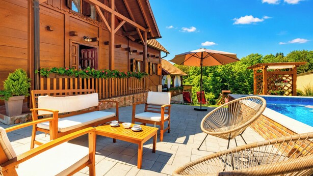 A wooden building with a pool, outdoor seating, and a pergola. - Rustic Cottage With Heated Pool (Velika Gorica)