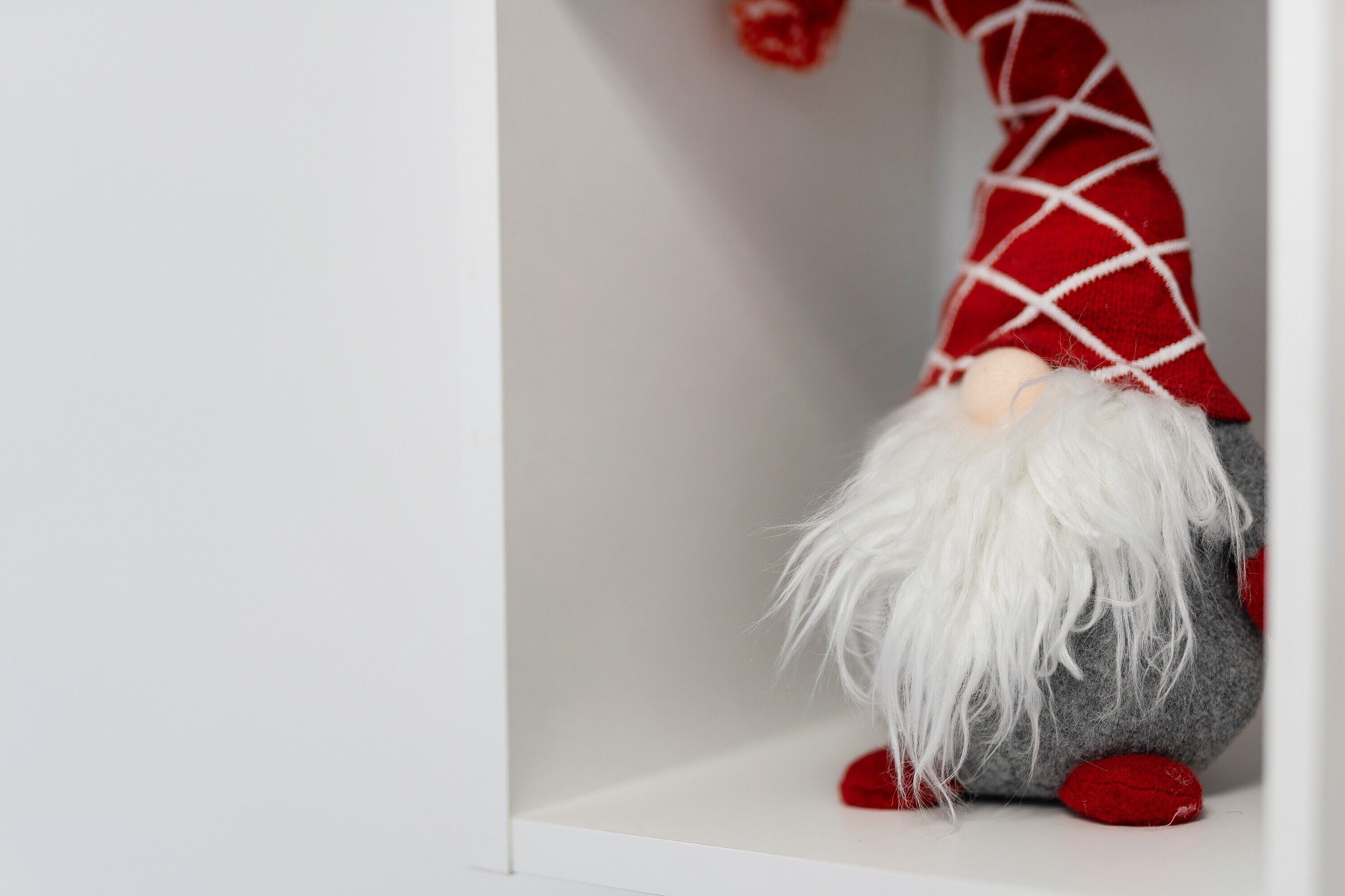 A gnome figurine with a red hat and white beard.