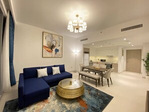 Panoramic Apartment | Living area | 60-inch Smart TV with cable channels, TV, Netflix - Lux BnB The Grand Creek Harbor Views (Dubai)