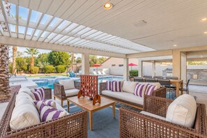 Outdoor sofas and giant Connect Four sit by the pool. Play a game and cool off in the shade. - The Cardinal | Ultimate Group Retreat in Glendale (Glendale)