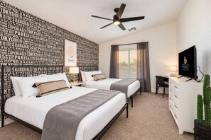Bedroom two has two beds, a desk, and a TV. It's great for friends or kids sharing a room. - The Cardinal | Ultimate Group Retreat in Glendale (Glendale)